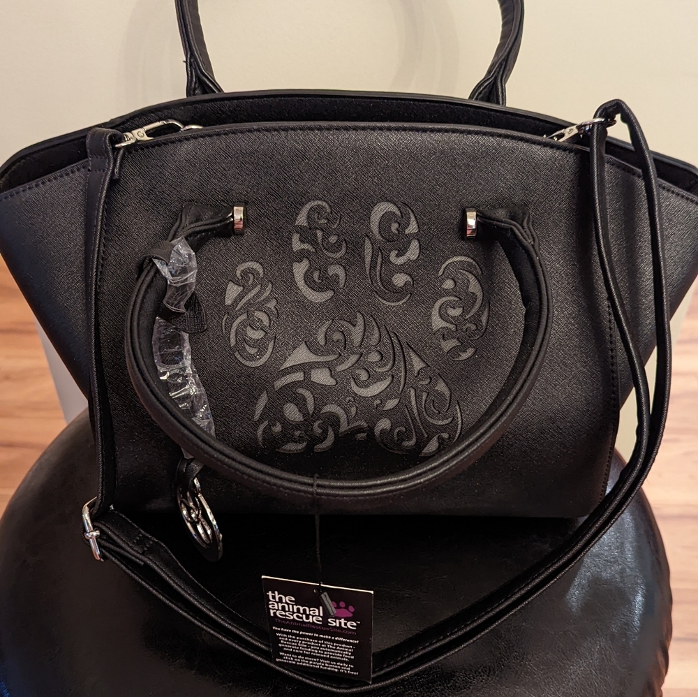 Brand new w/tags. Animal Rescue Site. Black stylish engraved PAW print purse.